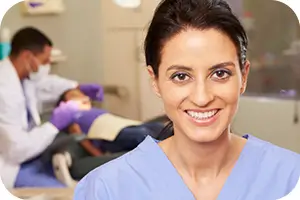 Smiling dentist at her dental office.