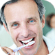 Man brushing his teeth.