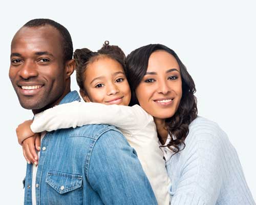 Mom and Dad and little girl hugging.