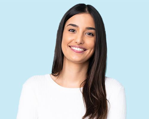 Smiling young woman giving thumbs up